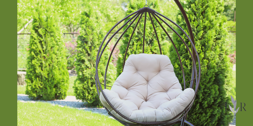 Garden reset nook with a hanging chair in a quiet sunny garden corner